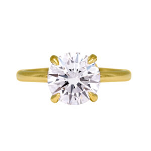 yellow gold solitaire engagement ring set with a round brilliant diamond