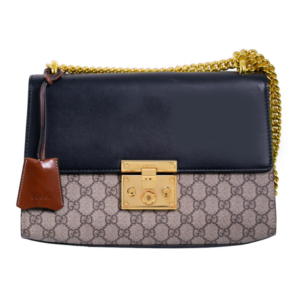 gucci handbag with black leather and GG supreme canvas and gold tone details