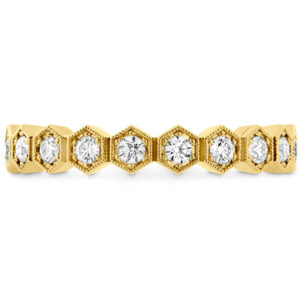 yellow gold band with hexagon bezels set with round diamonds