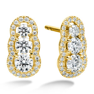yellow gold earrings set with 3 round diamonds stacked vertically with an integrated halo