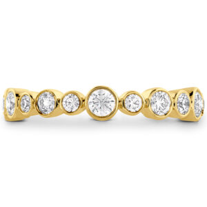 yellow gold bezel set band with round brilliant diamonds of different sizes