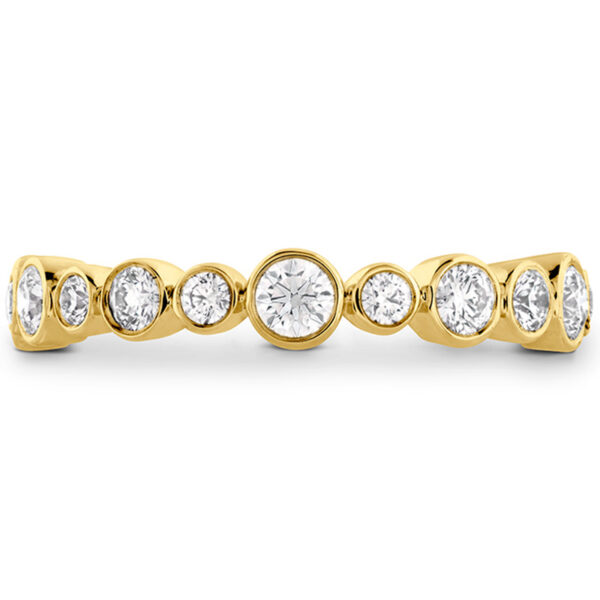 yellow gold bezel set band with round brilliant diamonds of different sizes