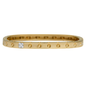 yellow gold bangle bracelet set with 0.07 carats of diamonds