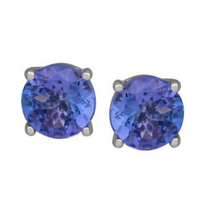 white gold earrings set with round tanzanite