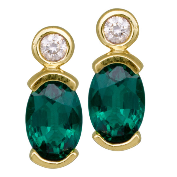 yellow gold drop earrings with oval emeralds and round brilliant diamonds