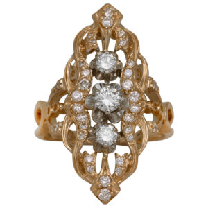 yellow gold cut out elongated ring set with round brilliant diamonds