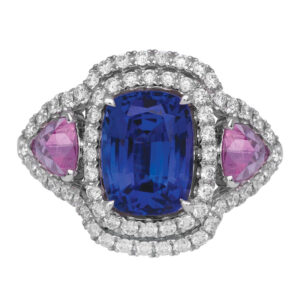 white gold halo ring with a cushion tanzanite, trillion pink sapphire, and small round diamonds
