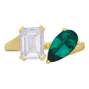 yellow gold toi et moi ring with an emerald cut diamond & pear cut emerald