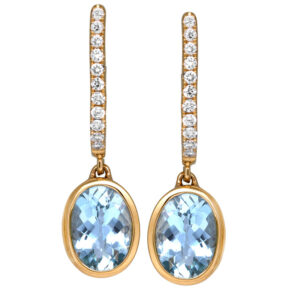 yellow gold drop earrings set with oval aquamarine and small round brilliant diamonds
