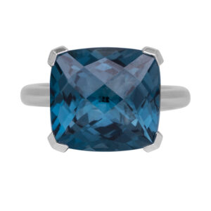 white gold solitaire ring set with a cushion london blue topaz