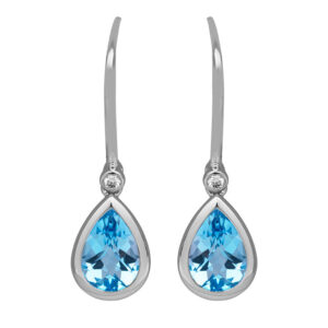 white gold drop earrings set with pear cut blue topaz
