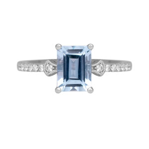 white gold ring centered with an emerald aquamarine and round diamonds in the band