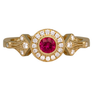 yellow gold halo ring centered with a ruby surrounded by a round diamond halo