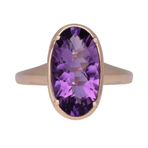 yellow gold ring with a large oval checkerboard amethyst