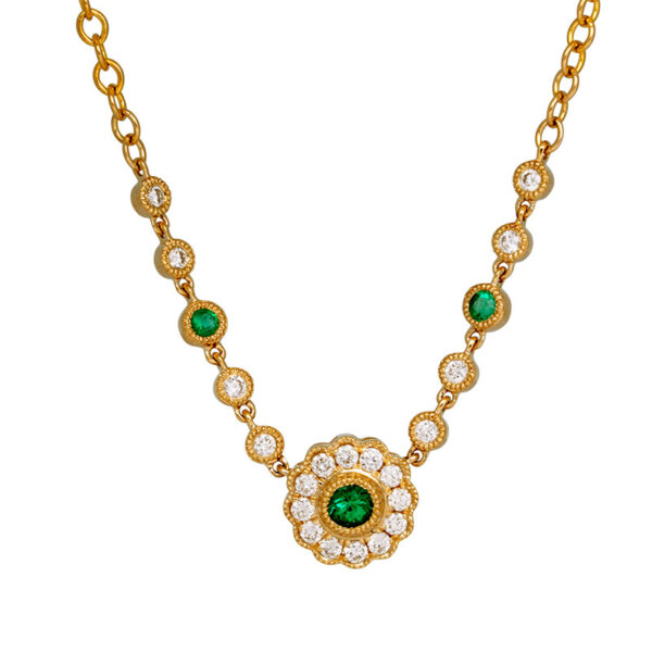 yellow gold necklace set with round brilliant emeralds surrounded by round brilliant diamonds