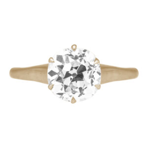 antique yellow gold solitaire ring centered with an old mine diamond