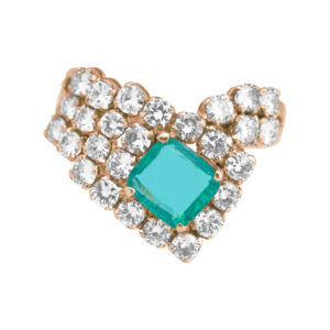yellow gold halo crossover ring set with a square emerald and round diamonds