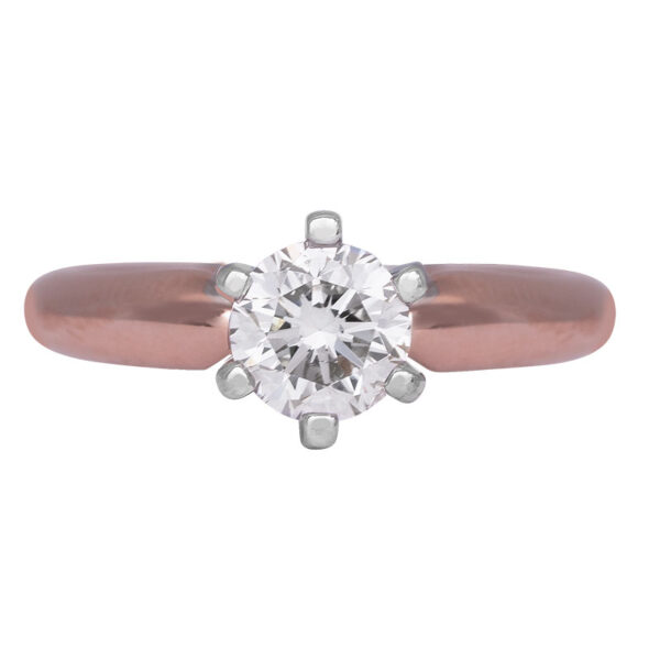 rose and white gold solitaire engagement ring set with a round diamond