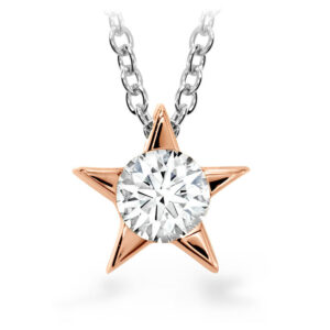 rose gold star pendant set with a round diamond on a white gold chain