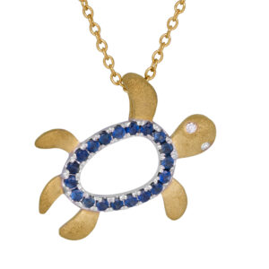 yellow gold turtle pendant set with round blue sapphires and a round brilliant diamond