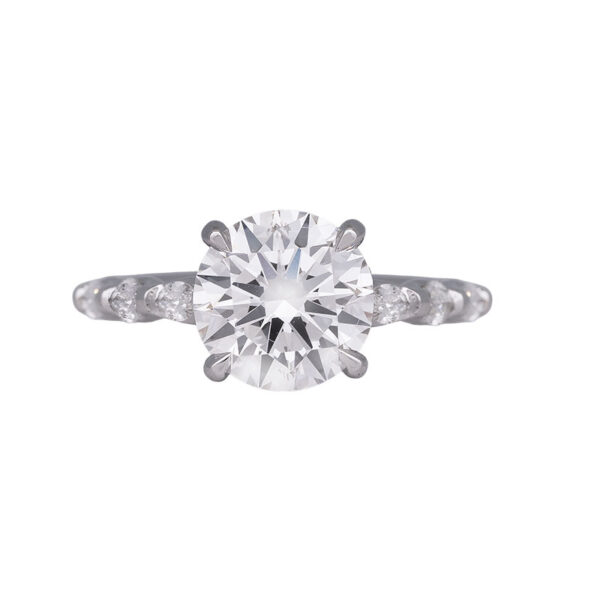 white gold engagement ring centered with a round brilliant diamond and round and marquise diamonds in the band