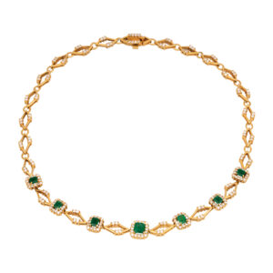 yellow gold geometric choker necklace set with emerald cut emeralds surrounded by round brilliant diamonds
