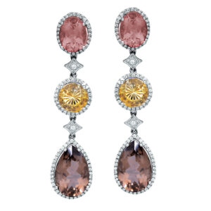 white gold drop earrings set with multiple colored gemstones surrounded by diamond haloes
