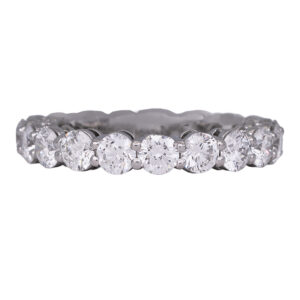 white gold eternity band set with round diamonds