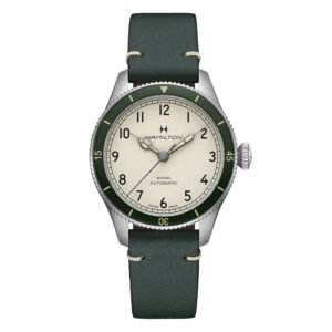 stainless steel watch with a cream dial and green leather strap