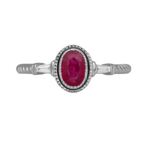 white gold ring centered with an oval ruby flanked by baguette diamonds