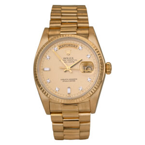 yellow gold Rolex with a champagne diamond dial
