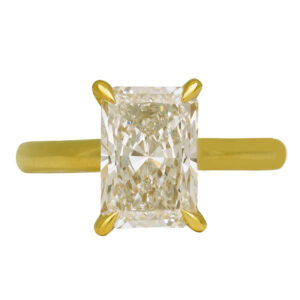 yellow gold under halo engagement ring centered with a radiant diamond surrounded by round diamonds in the under halo