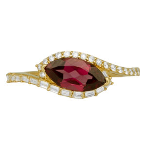yellow gold ring with a marquise rhodolite garnet surrounded by round brilliant & baguette diamonds