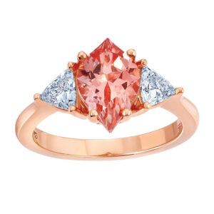 rose gold 3 stone ring centered with a champagne sapphire flanked by diamonds