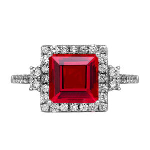 New 14k white gold Chatham ring centered with a 3.45 carat lab-grown square ruby surrounded by 0.53 carats of lab-grown round brilliant diamonds in the halo & band.