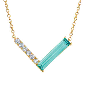 yellow gold v-shaped pendant set with a long baguette ocean blue chrysoberyl and round diamonds