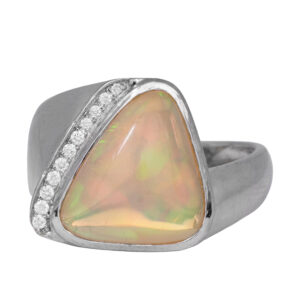 white gold tapered ring with a trillion opal and band of round diamonds
