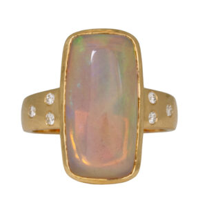 yellow gold ring with elongated cushion ethiopian opal and round diamonds in the band