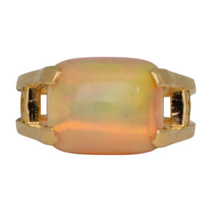 yellow gold ring set with an elongated cushion Ethiopian opal and small round diamonds