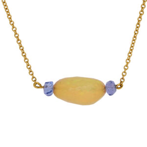 yellow gold bead necklace set with an oval freeform opal bead and round tanzanite beads