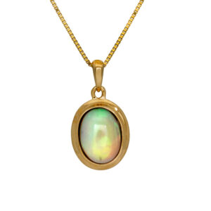 yellow gold pendant set with an oval cabochon opal
