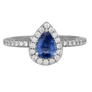 white gold engagement ring centered with a pear sapphire surrounded by diamonds in the halo & band.