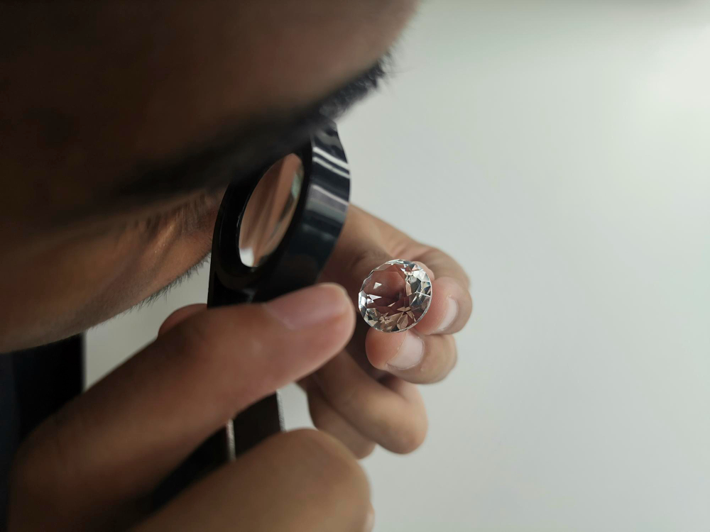Person inspecting a diamond closely