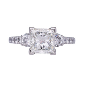 white gold engagement ring centered with a princess diamond surrounded by round diamonds