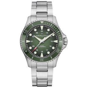 stainless steel watch with a green bezel and dial with white markers