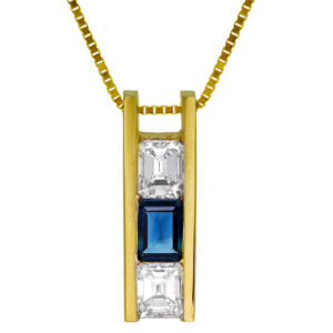 yellow gold drop pendant channel set with two emerald cut diamonds surrounding an emerald cut sapphire