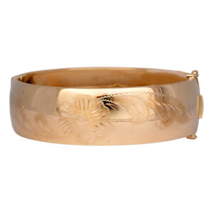 yellow gold bangle bracelet engraved with floral motif