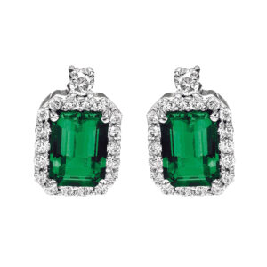 white gold halo earrings set with emerald cut emeralds and surrounded by round diamonds