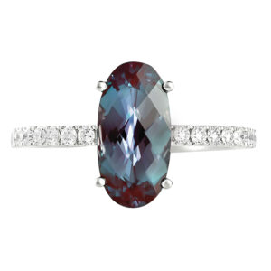 white gold ring set with an oval alexandrite and round diamonds in the band