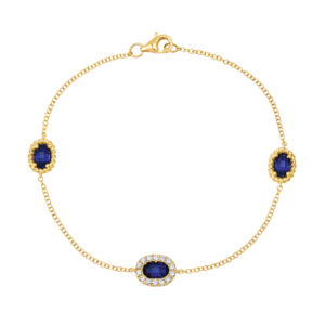 yellow gold cable link bracelet set with oval sapphires surrounded by round diamonds